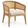 Chaise beige à accoudoirs courbés, dossier ajouré et coussin clair