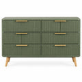 Commode verte à six tiroirs striés et poignées dorées